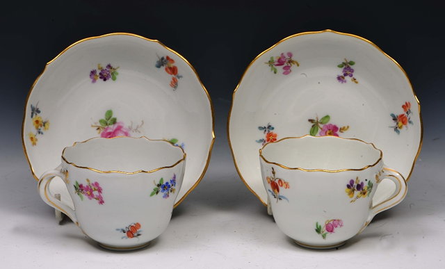 Appraisal: Pair of Meissen white ground small cups and saucers