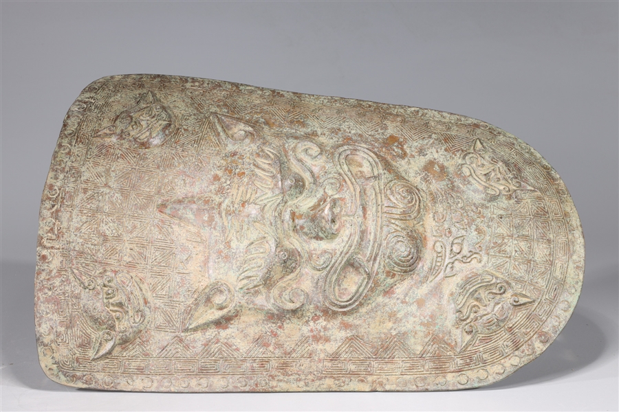 Appraisal: Chinese archaistic bronze shield with intricately molded and incised designs