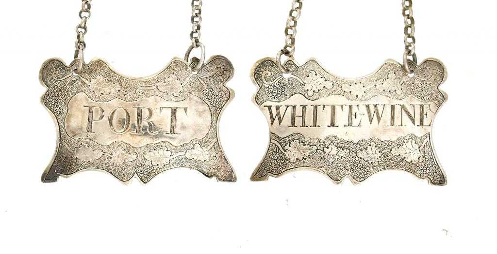 Appraisal: A PAIR OF GEORGE III SILVER WINE LABELS shield shaped