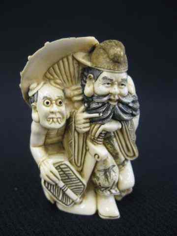 Appraisal: Carved Ivory Netsuke of a Man Oni fancy polychrome signed