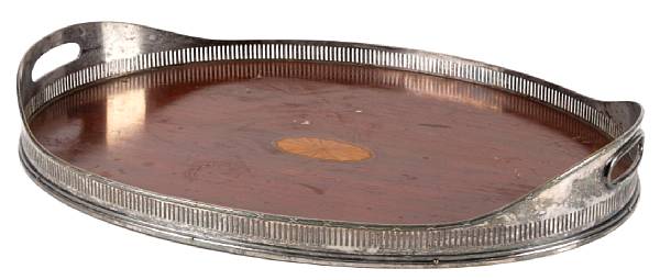 Appraisal: An inlaid mahogany serving tray with galleried edge length in