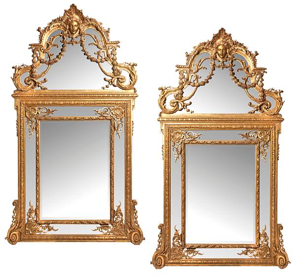 Appraisal: A pair of Regence style giltwood mirrors Each with stepped