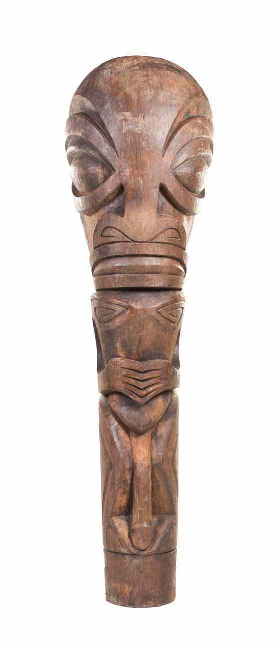 Appraisal: A Carved Wood Tiki depicting a crouching male with clasped