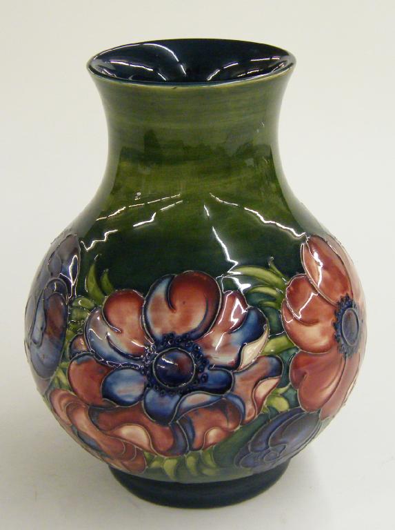 Appraisal: Moorcroft 'Anemone' design ovoid vase decorated upon a mottled green