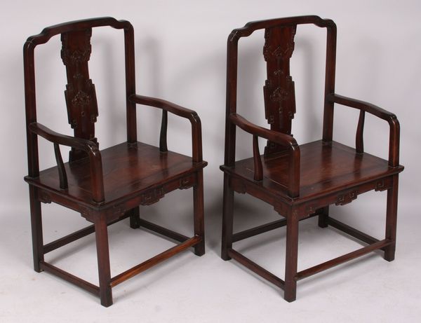 Appraisal: Pair of th Century Chinese teakwood armchairs with carved backs