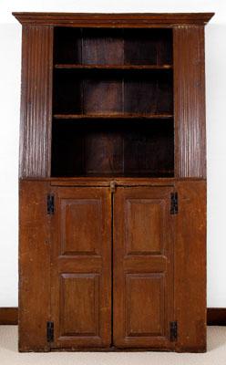 Appraisal: New England slant-back wall cupboard pine throughout single-case rosehead nail