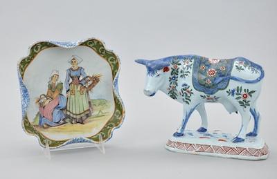 Appraisal: A Faience Cow Figure and a Decorated Dish The cow