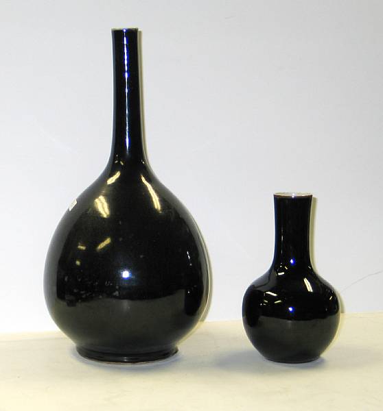 Appraisal: Two black glazed porcelain vases One with a narrow stick