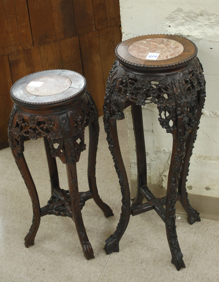 Appraisal: TWO SIMILAR CARVED HONGMU PEDESTAL TABLES Chinese export early th