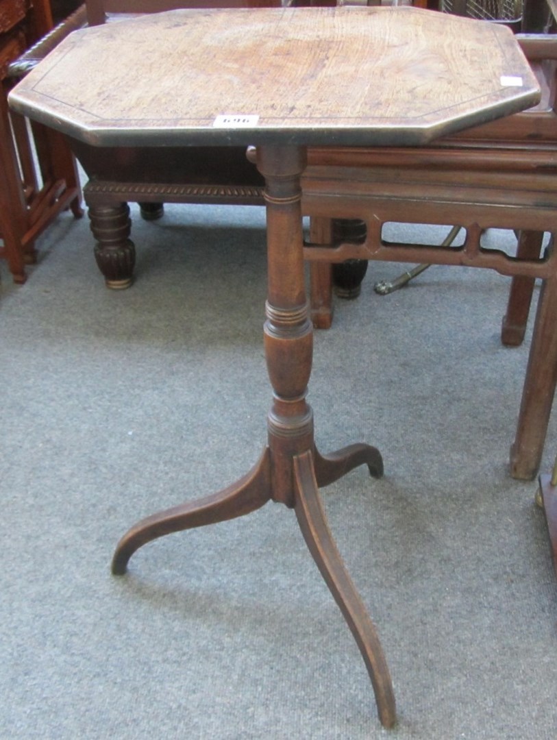 Appraisal: A George III mahogany octagonal snap top occasional table on