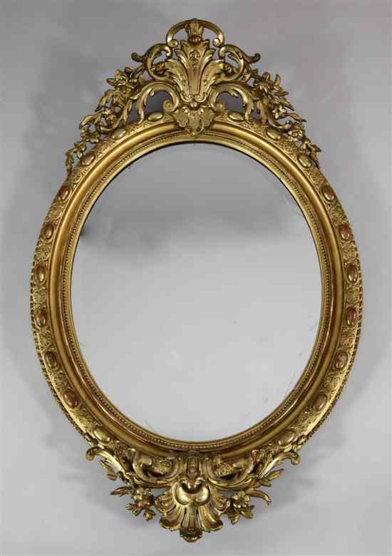 Appraisal: A Victorian carved giltwood and gesso oval wall mirror with