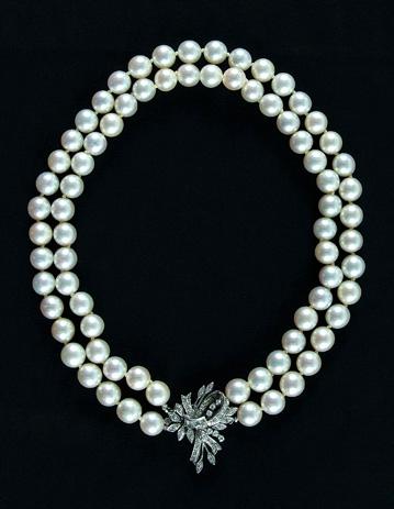 Appraisal: Pearl and diamond necklace knotted double strand of pinkish-white cultured