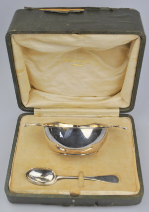 Appraisal: A cased silver two-handled sugar basin with spoon London retailed