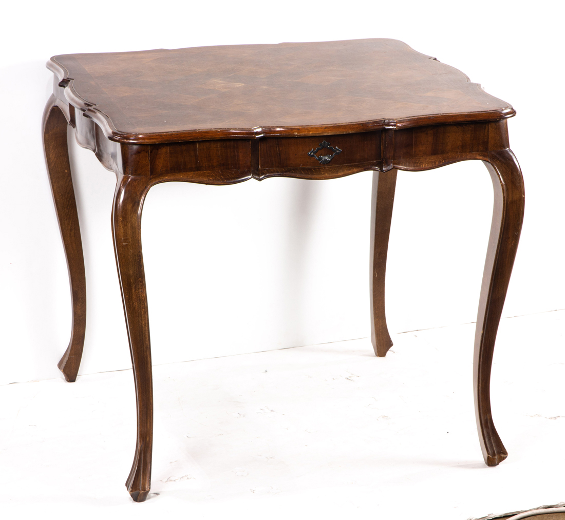 Appraisal: A Louis XV style games table having a shaped rectangular