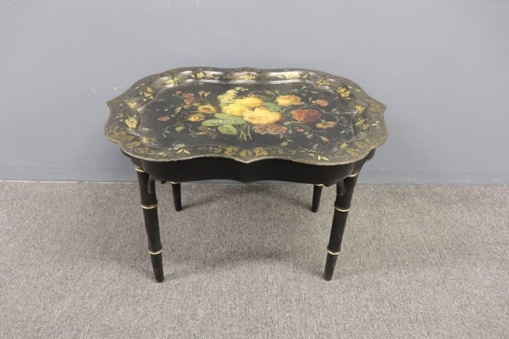 Appraisal: Victorian tole decorated tray table resting on a base of