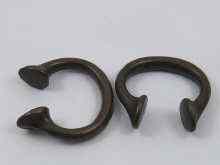 Appraisal: Two cast bronze '' Manillas '' or slave tokens reputed