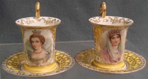 Appraisal: Pr Carlsbad Austria porcelain portrait cups and saucers yellow ground