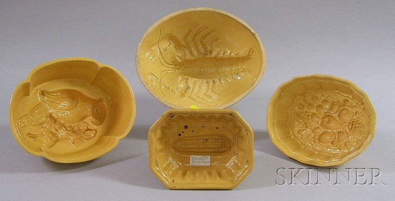 Appraisal: Four Yellowware Culinary Molds a lobster corn fruit and a