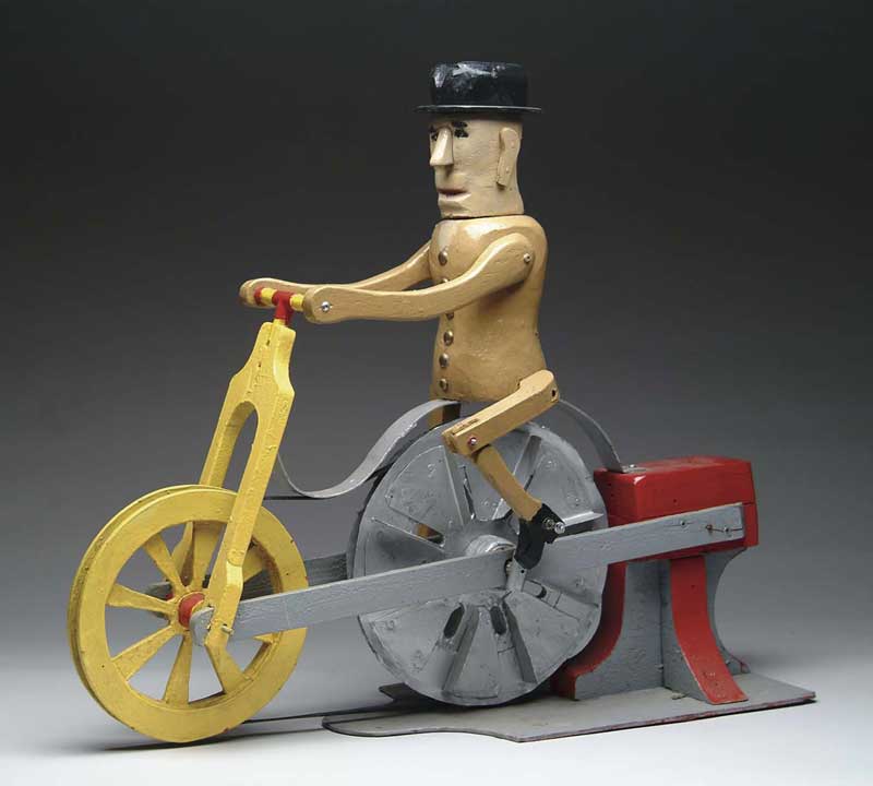 Appraisal: INTERESTING PAINTED MECHANICAL BICYCLE WHIRLIGIG Bone crusher bike painted in