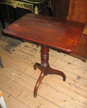 Appraisal: A MAHOGANY TRIPOD TABLE the rounded oblong tip up top