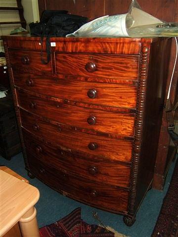 Appraisal: A Scottish mahogany bow fronted chest of two short and