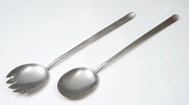 Appraisal: A PAIR OF STYLISED SILVER SALAD SERVERS Birmingham maker's mark