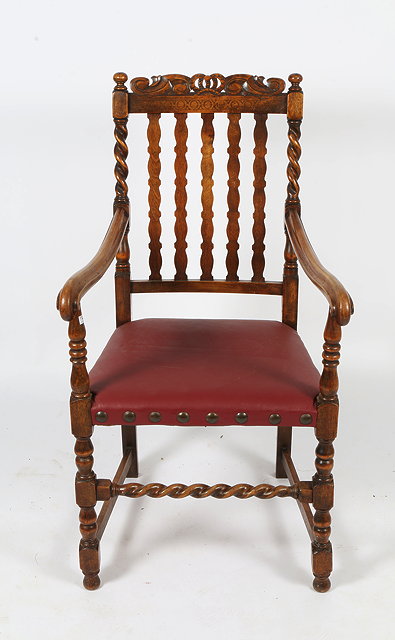 Appraisal: A CAROLEAN STYLE OPEN ARMCHAIR with vertical lath back a