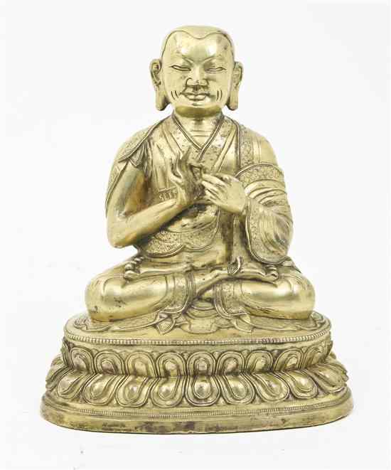 Appraisal: A Gilt Bronze Figure depicting a Buddhist Disciple on a