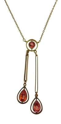 Appraisal: An unusual Art Nouveau tourmaline pendant With three apricot coloured