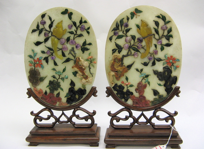 Appraisal: PAIR ORNATE CHINESE CARVED OVAL TABLE SCREENS Hand carved landscape