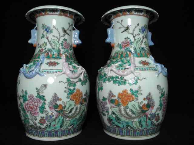 Appraisal: Pair th century Chinese porcelain vases Figural dog handles with