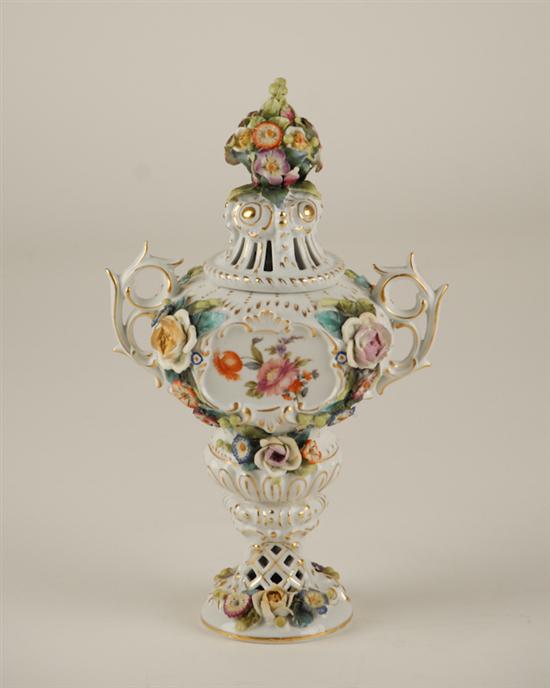 Appraisal: A Continental Porcelain Covered Urn in the style of Dresden