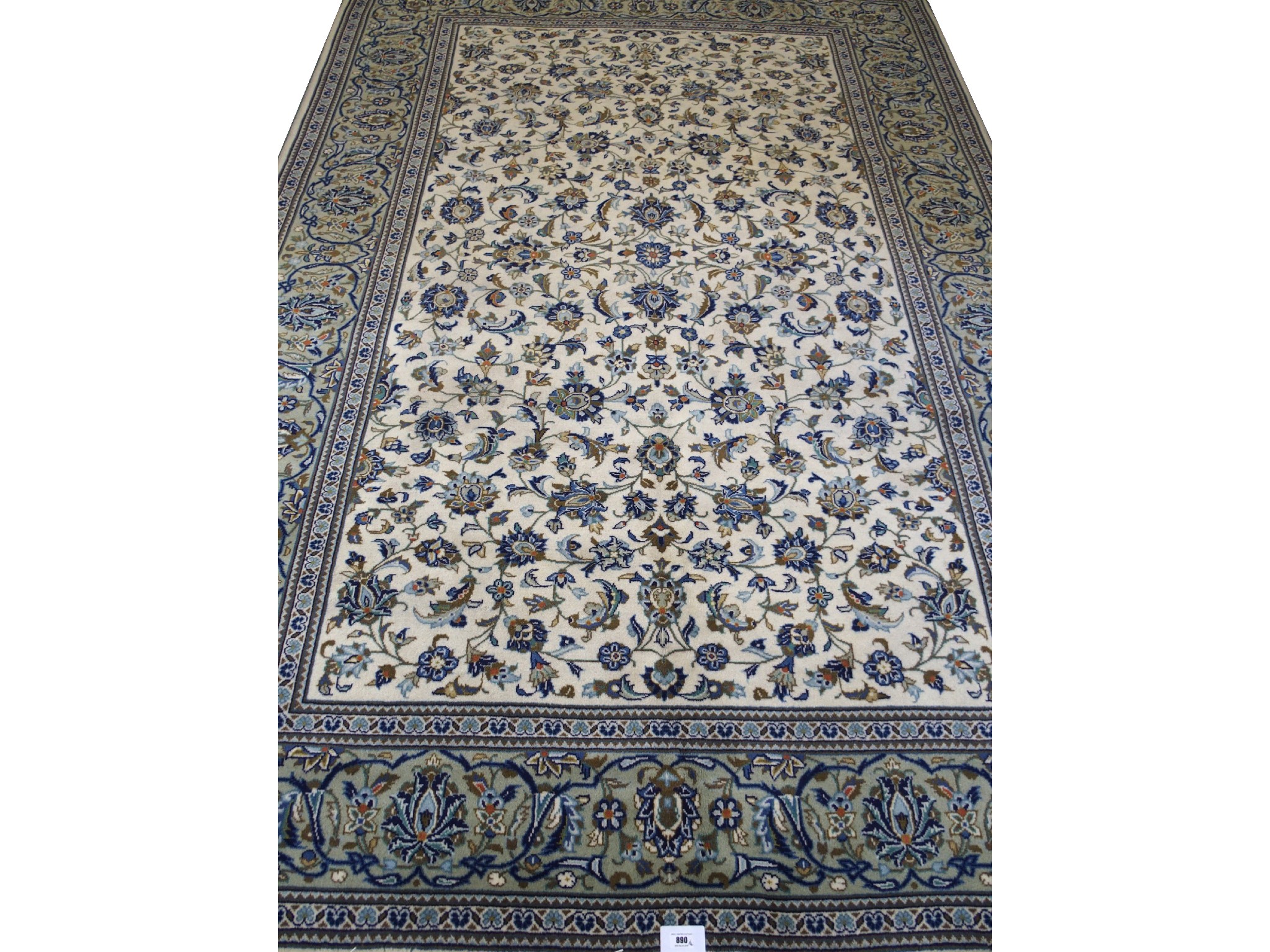 Appraisal: A Kashan cream ground rugwith multi-foliate ground within a repetitive