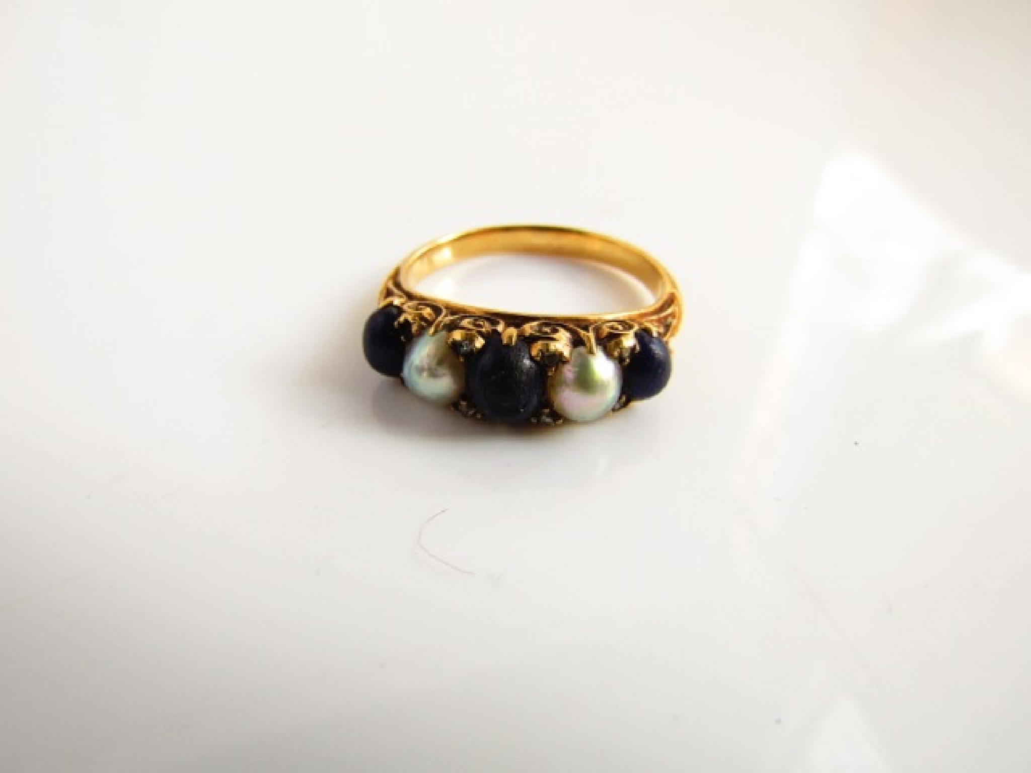 Appraisal: An Edwardian style ring set with three lapis lazuli and