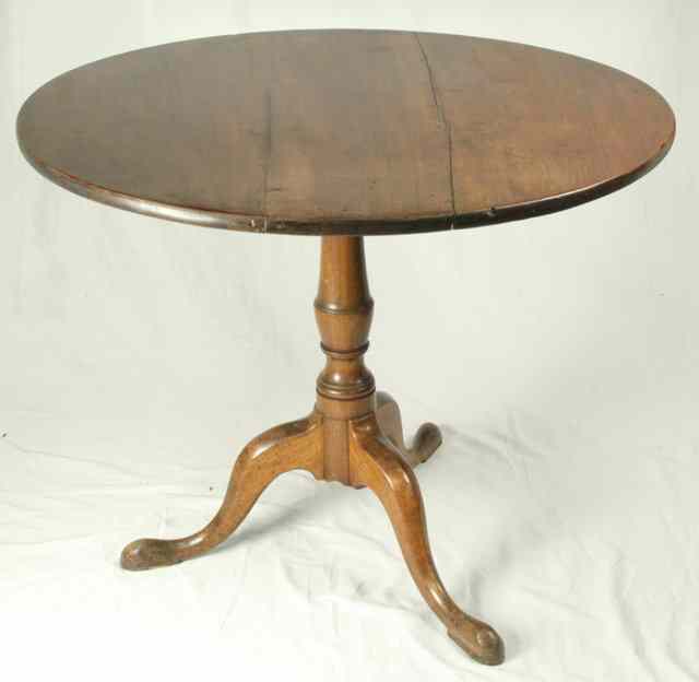 Appraisal: A late Georgian circular mahogany table raised on a turned