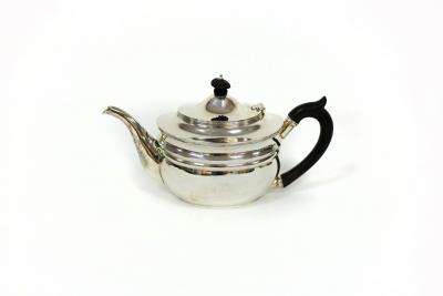 Appraisal: A silver teapot London of oval shape with ebonised finial