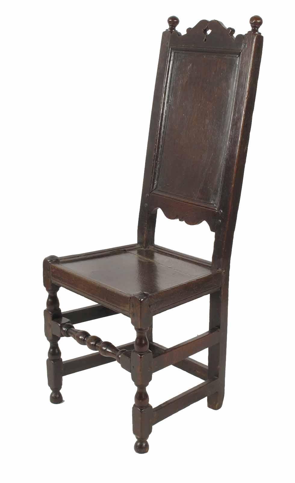 Appraisal: A th century English oak panel back chair