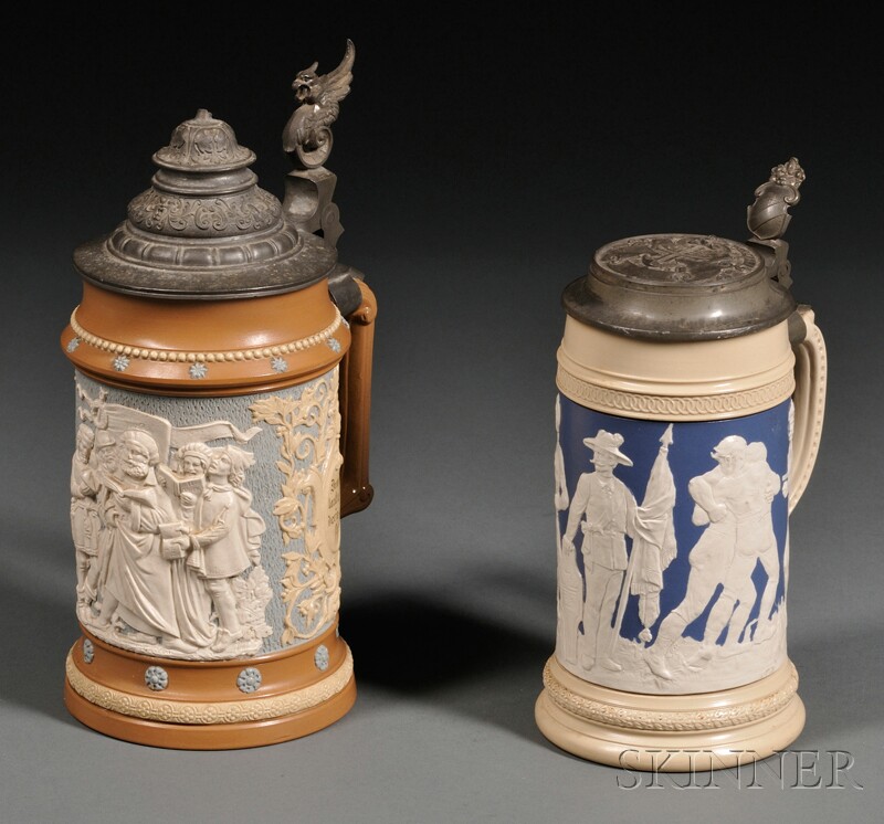 Appraisal: Two Pewter-mounted Mettlach Relief Steins Germany late th century a