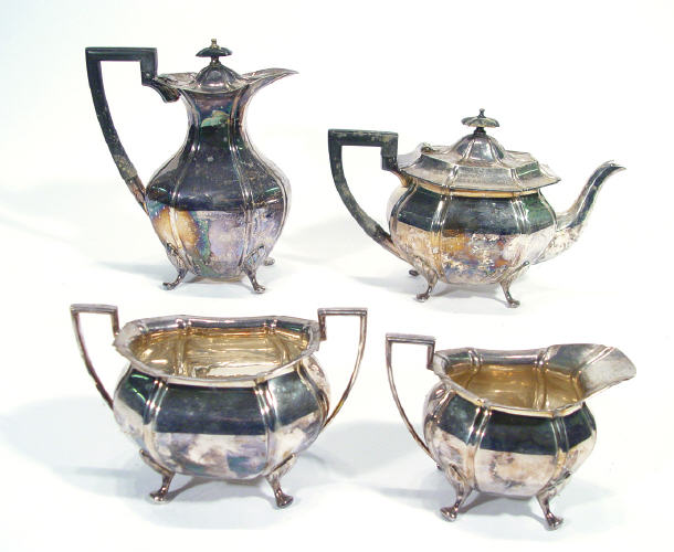 Appraisal: Four piece fluted silver plated teaset with ebony knops and