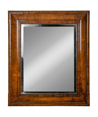 Appraisal: A late th Century walnut cushion framed mirror with rectangular