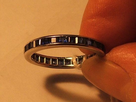 Appraisal: A SAPPHIRE SET FULL ETERNITY RING square cut sapphires mounted