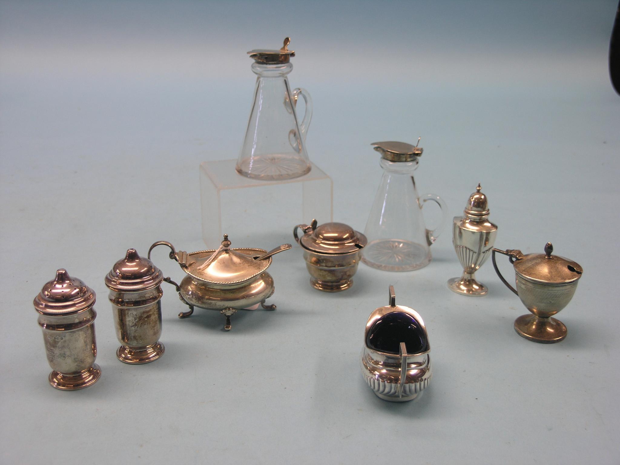 Appraisal: A pair of silver condiments three silver mustard pots two