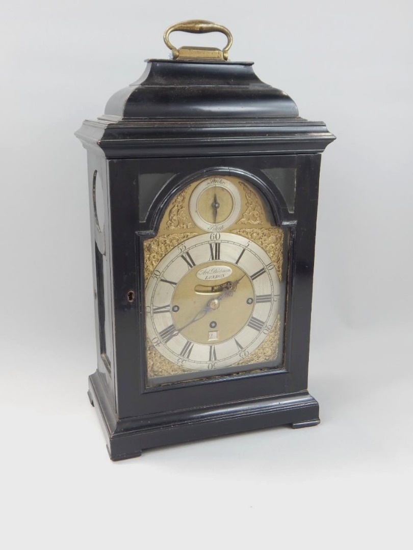 Appraisal: A George II ebonised bracket clock by Arlander Dobson with