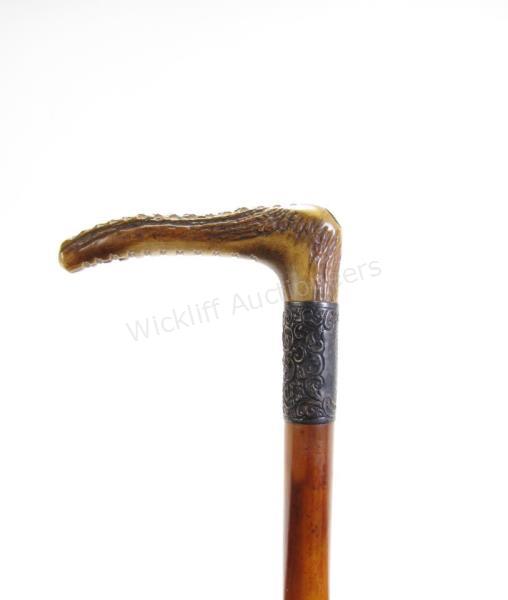 Appraisal: Fancy Dress Cane solid wood shaft antler handle with makers