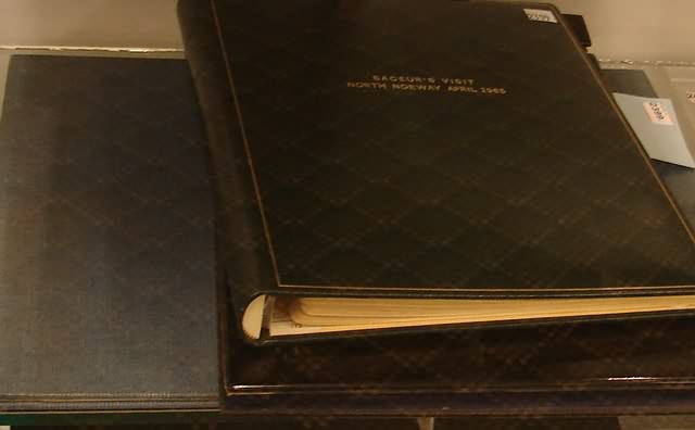 Appraisal: Grouping of two photograph albums lacquer covered photo album showing