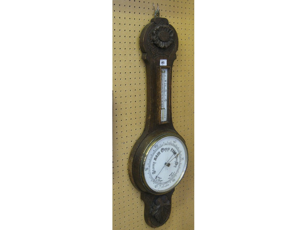 Appraisal: Carved oak cased banjo barometer