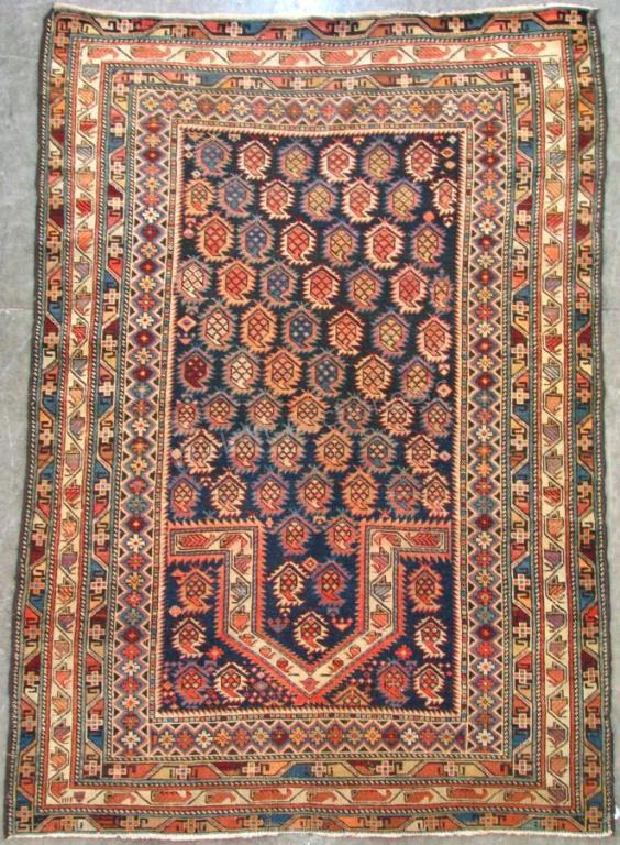 Appraisal: Handmade Oriental Area Rug Caucasian design blue field with tan