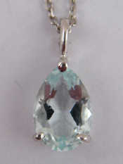 Appraisal: A white metal tests carat gold aquamarine pendant and chain