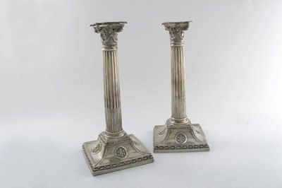 Appraisal: A pair of George III silver candlesticks Corinthian column form