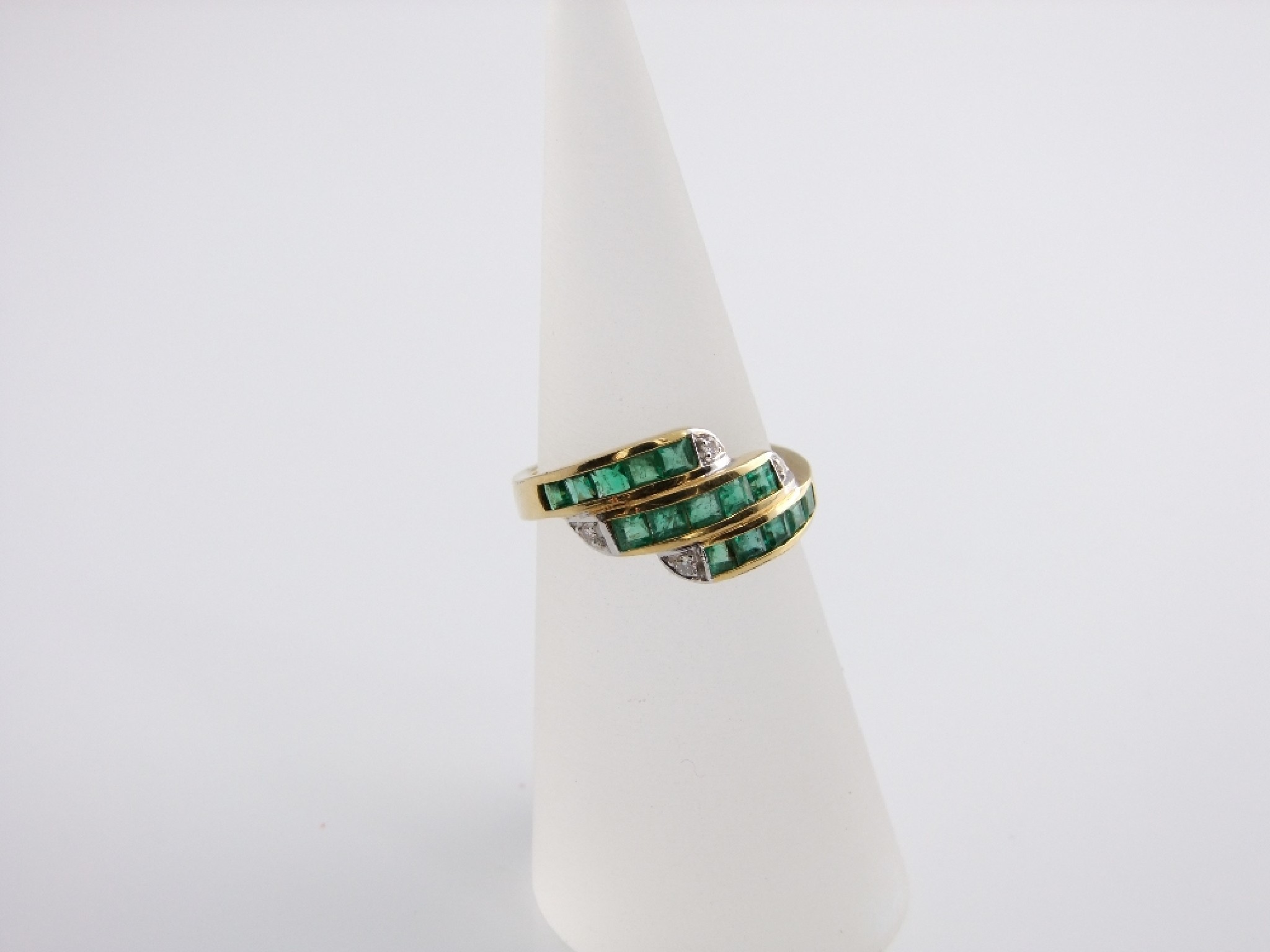 Appraisal: An ct gold emerald and diamond set ring in three